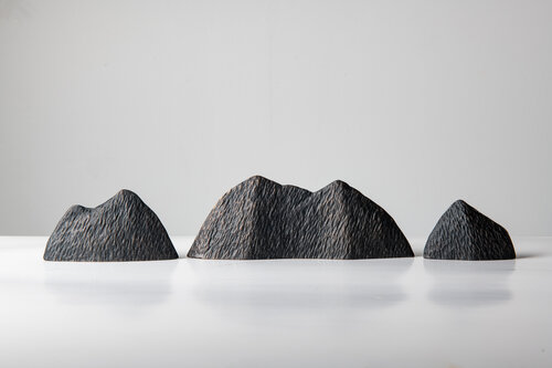 a set of bronze Moving Mountains I